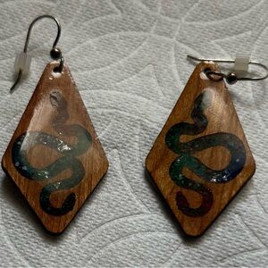 Bula Stone brand crushed stone and wood snake earrings.